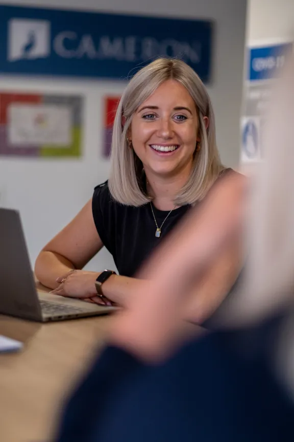 Photo of a lady smiling. 