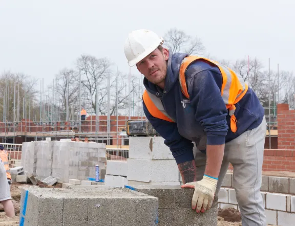 Man in hardhat on a building site