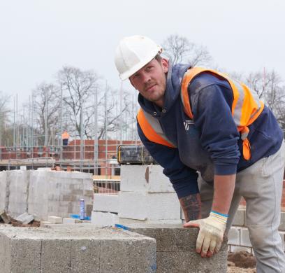 Man in hardhat on a building site