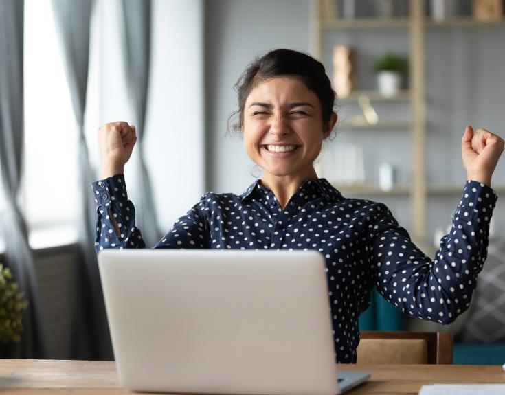 Happy woman at laptop