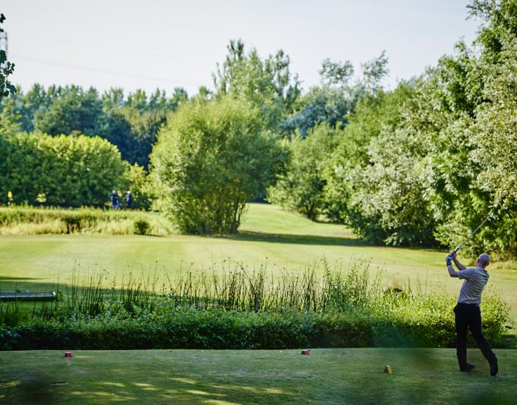 Man playing golf